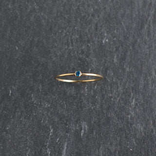 Blue CZ stacking ring featuring a sapphire September birthstone, crafted by Yay Hawaii, with a sleek, polished band.