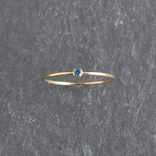 Blue CZ stacking ring featuring a sapphire September birthstone, crafted by Yay Hawaii.