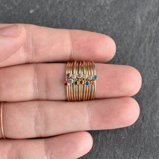 Aqua CZ stacking ring with December birthstone zircon, featuring a silver band and sparkling blue gemstone.
