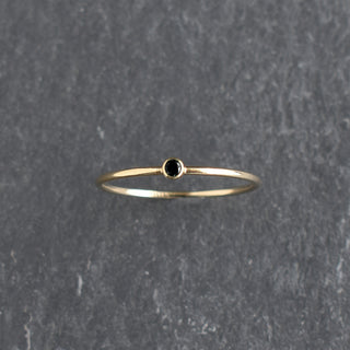 Black CZ stacking ring by Yay Hawaii featuring sparkling cubic zirconia stones on a sleek black band.