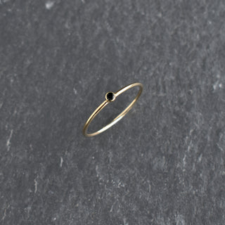 Black cubic zirconia stacking ring by Yay Hawaii featuring multiple thin bands with sparkling stones.