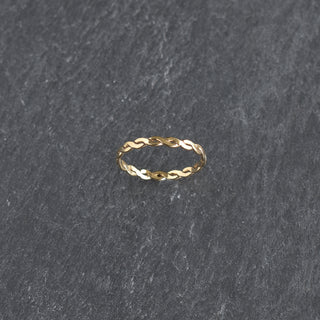Stacking ring with woven texture from Yay Hawaii, featuring intricate woven pattern and polished metal finish.