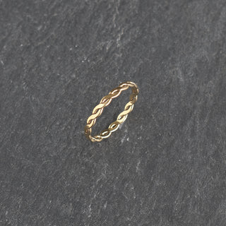 Stacking ring with woven texture by Yay Hawaii, showcasing a close-up of the intricate woven design and shiny metal finish.