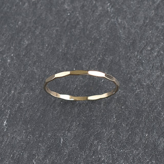 Faceted stacking ring by Yay Hawaii featuring multiple shining gemstones and a sleek, modern design.