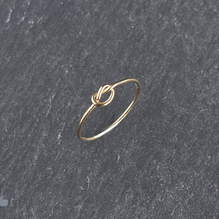 Yay Hawaii knotted stacking ring with intertwined silver bands, showcasing a stylish and minimalist jewelry design.