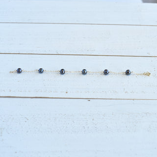 Dainty 8mm black freshwater pearl station bracelet by Yay Hawaii, featuring elegant pearls on a delicate chain.