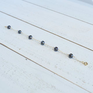 Dainty 8mm black freshwater pearl station bracelet by Yay Hawaii featuring polished pearl beads on a delicate chain.