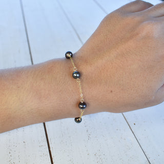 Dainty 8mm black freshwater pearl station bracelet by Yay Hawaii, featuring smooth round pearls on a delicate chain.