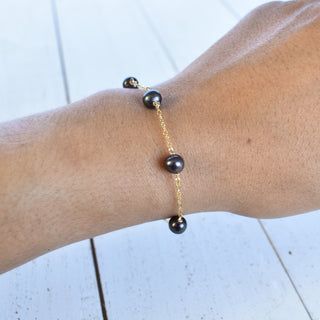 Dainty 8mm black freshwater pearl station bracelet featuring smooth pearls on a delicate chain, by Yay Hawaii.