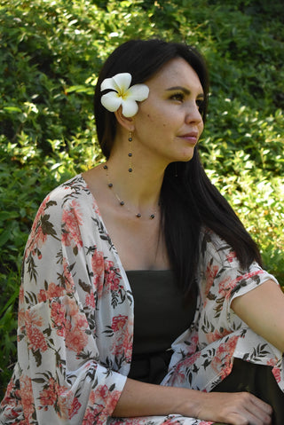 Dainty 8mm black freshwater pearl station necklace featuring evenly spaced pearls on a delicate chain.