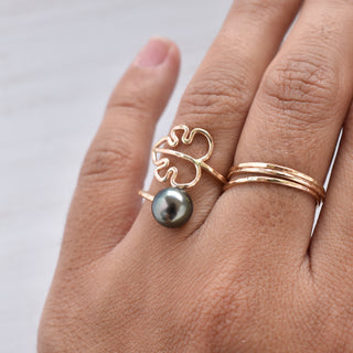 Monstera bypass pearl ring featuring Tahitian or freshwater pearl with gold band, showcasing a modern botanical jewelry design.